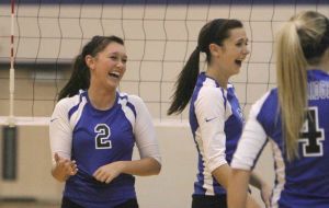 Oak Ridge’s Whitney Wofford (2) laughs with teammates after missing a dig during a match against Bryan on Tuesday. To view or purchase this photo and others like it, visit HCNpics.com.