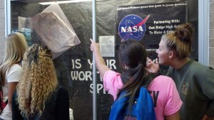 Kayli Anthony, Shawntavia Davis, Tessa Diller, and Taylor Clemens admire the display.