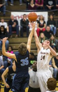 The Woodlands senior forward Cody Mason (24), pictured here playing against Kingwood, led the Highlanders with 14 points in a 58-39 victory over Cy Lakes on Monday afternoon.