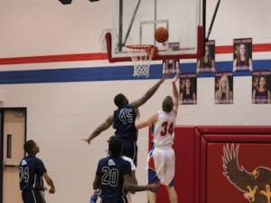 War Eagle forward George Buck finishes a fast break with a lay-up. Photo Credit: Brian Duval