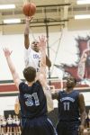 College Park’s Kyle Robertson shoots during the Cavaliers’ 43-37 bi-district win over Kingwood at Porter High School.