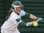 The Woodlands' Kelcy Leach drops down a bunt against Liberty on Saturday. 