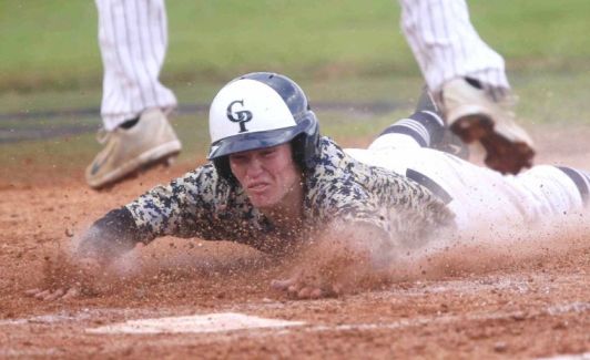 College Park’s Austin Stokes slides into home plate as St. Pius X’s Joel Gregory leaps over him in the second inning during a high school baseball game at the Ferrell Classic tournament Friday. College Park defeated St. Pius X 7-4. To view or purchase this photo and others like it, visit HCNpics.com.