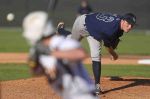 College Park's Montana Parson throws to a Deer Park batter during a high school baseball game at the Wing 'N More Classic Thursday