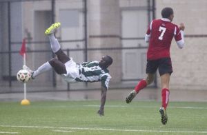 The Woodlands midfielder Buba Jobe attempts a bicycle kick during a Region II-5A bi-district playoff match against Westfield on Thursday at Woodforest Bank Stadium in Shenandoah. Jobe missed the shot but finished the half with a pair of goals and an assist as the Highlanders defeated the Mustangs 5-1. To view or purchase this photo and others like it