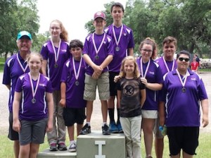 Woodlands JOAD archers at the awards ceremony for the Texas State JOAD Outdoor Championship in Columbus, TX. Pictured from left to right are Coach Steve Overbeck, Zoe Panagos, Sophia Hickerson, Gabe Karl, Blaise Shipp, Jon Welch, Shelby Smith, Sadie Hickerson, Jack Overbeck, and Becca Kelly.
