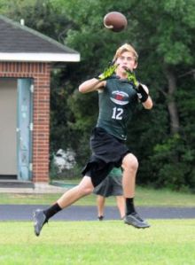 The Woodlands Hunter Moore catches a TD pass during the 7 on 7 state qualifying football tournament at The Woodlands High School.
