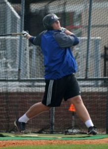 Oak Ridge junior Luken Baker drives a ball during batting practice at ORHS