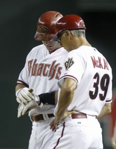 Arizona Diamondbacks first baseman Paul Goldschmidt shows first base coach Dave McKay where he was hit by a pitch during the ninth inning of Friday’s game against the Pittsburgh Pirates in Phoenix