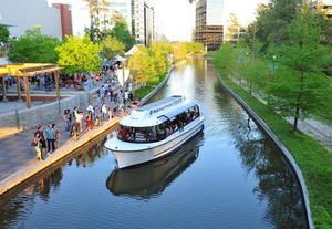 The Woodlands CVBA Waterway Cruiser drifts past Waterway Square in The Woodlands. The Woodlands CVB may consider making rides on Waterway Cruisers free. Currently, it costs $5 per adult and $2.50 per child