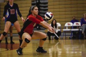 Oak Ridge’s Raigen Cianciulli digs the ball against Conroe earlier this season.