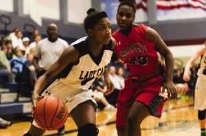 College Park's Jala Buster, left, tries to get past Westfield defenders during a high school game at College Park. Westfield won 63-60.
