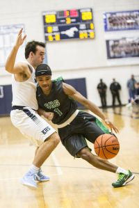 Spring's Aloysius James (1) drives during Kingwood's 38-32 loss to Spring on Dec. 19, 2014, at Kingwood High School.