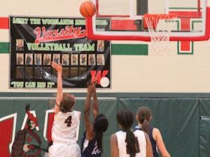 Junior Payton Walker goes for a hook-shot in the fourth quarter against Kingwood.
