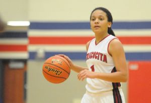 Atascocita's Shae Moore brings the ball down court against Klein in a District 13-5A game at Atascocita High School last Friday.
