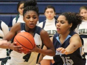 Freshman Jala Buster drives the lane for a lay-up in the fourth quarter of Tuesday's district game vs. Kingwood.