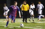 Conroe’s Emmy Orioha (7) tries to get past Oak Ridge defenders during the high school boys soccer game on Tuesday at Moorhead Stadium.