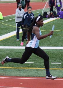 Mustang Inne Cheetham-West sprints around the turn and heads for the finish line in the 4x100 relay at the Sam Mosely Relays. The Mustang girls took home the team title.