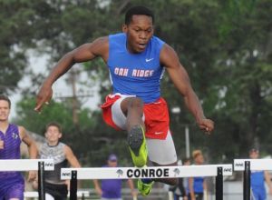 Oak Ridge’s Patrick Prince competes in the 300-meter hurdlesat Buddy Moorhead Stadium in Conroe on Thursday.