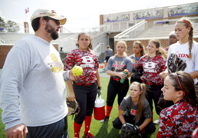 Belton High School head softball coach Matt Blackburn talks to his team during practice Tuesday at the University of Mary Hardin-Baylor's Crusader Stadium in Belton.
