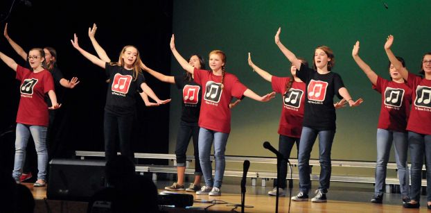 Region Girls Choir members perform during the McCullough Junior High choir's pop concert at the Nancy Bock Center of the Performing Arts auditorium. 