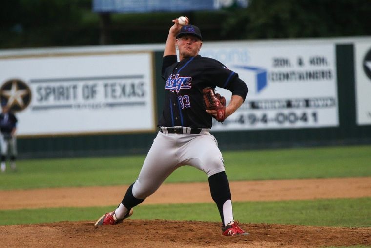 Oak Ridge's Luken Baker (33) throws a pitch during the high school baseball game against Conroe back in April.