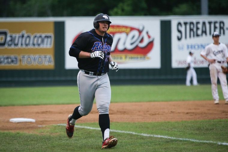 Oak Ridge's Luken Baker runs for home after hitting a home run during the high school baseball game against Conroe this year.