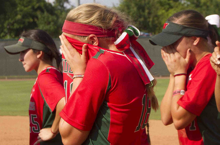 The Woodlands Emily Langkamp reacts after a walk-off single by Katy's Kourtney Coveney in the eighth inning the gave the Lady Tigers a 3-2 win in the Class 6A state semifinal game in Austin Friday. 