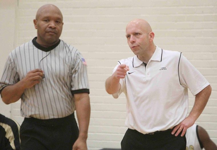 Former Conroe coach John Oliverio, right, makes a point of contention with an official during the annual Conroe Classic at The Pit. Oliverio was named Alvin’s coach earlier this week and leaves the Tigers after two seasons.