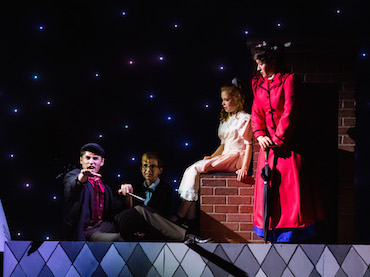 Bert (Gabriel Kearns), Michael (Grant Bottorff), Jane (Greta Lamb) and Mary Poppins (Katja Yanko), ponder on the rooftops of London.