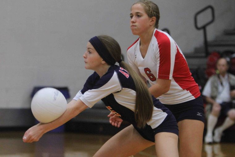 Bradyn Rice returns a serve as Chelsea Johnson looks on during a non-district match earlier this season.