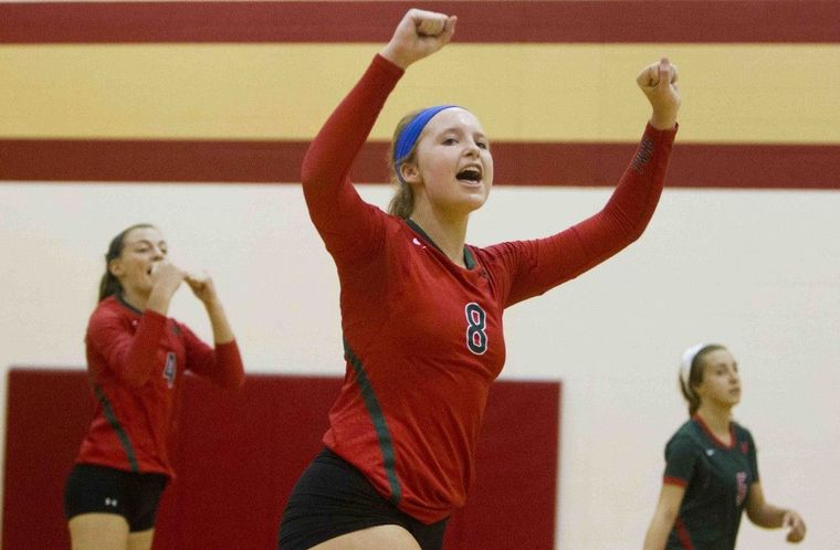 The Woodlands' Sophie Walls celebrates a point during a high school volleyball game Friday. Go to HCNPics.com to view more photos from the game.
