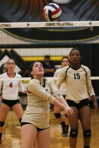 Conroe's Ally Herrera (2) sets the ball up for teammates during the high school volleyball match against Tomball on Monday. Tomball won in four sets.
