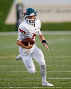Woodlands quarterback Eric Schmid runs with the ball during a high school football game Friday, Sept. 11, 2015 in Katy, Tx. Katy won 14-7