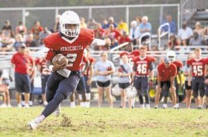 Atascocita quarterback Daveon Boyd turns the corner during the Atascocita spring football game on Friday at Atascocita High School.