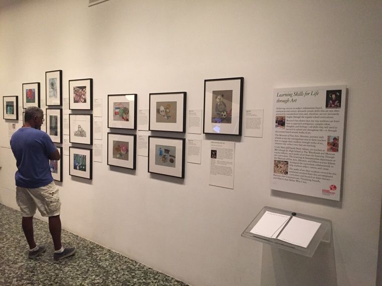 A man looks through the McCollough Junior High art students exhibit in the Kinder Foundation Education Center. There will be a reception on Sept. 27 at 2 p.m.