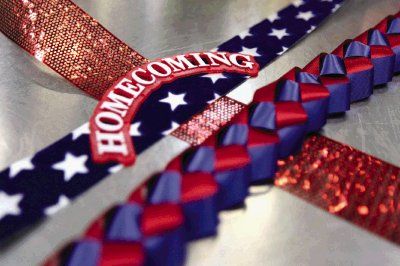 Probably the most fun part of a mum in the three - four foot trail of ribbon that hangs from the flowered focal point. Solid, patterned and sparkly ribbon is commonly seen hangin from mums. This is also when jingle bells, cowbells, other noisemakers and more trinkets and personalized flair should be added.