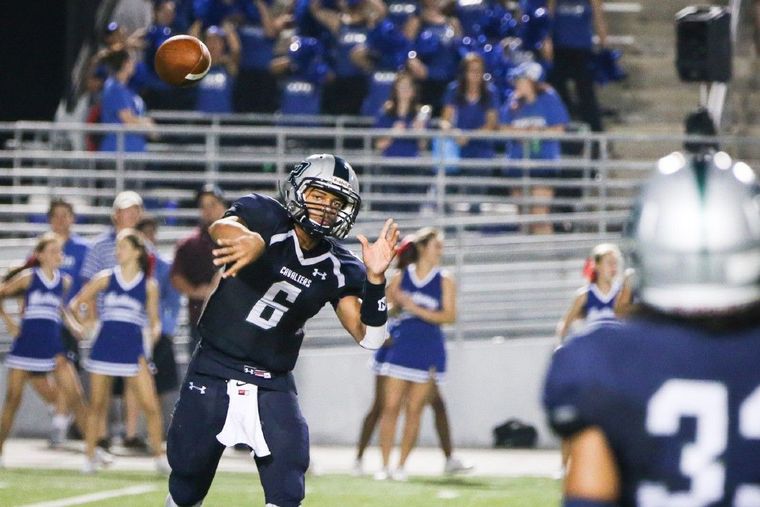 College Park's Jordan Turnquest (6) throws a pass to Dominic Garcia (33) during the high school football game against Katy Taylor on Friday at Woodforest Stadium.