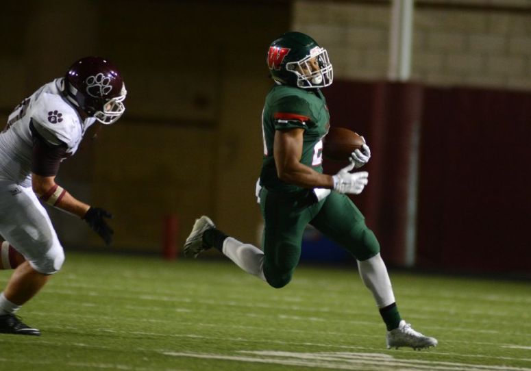 The Woodlands senior defensive back Antoine Winfield Jr., right, outruns a Cy-Fair defender on a punt return during the season opener.