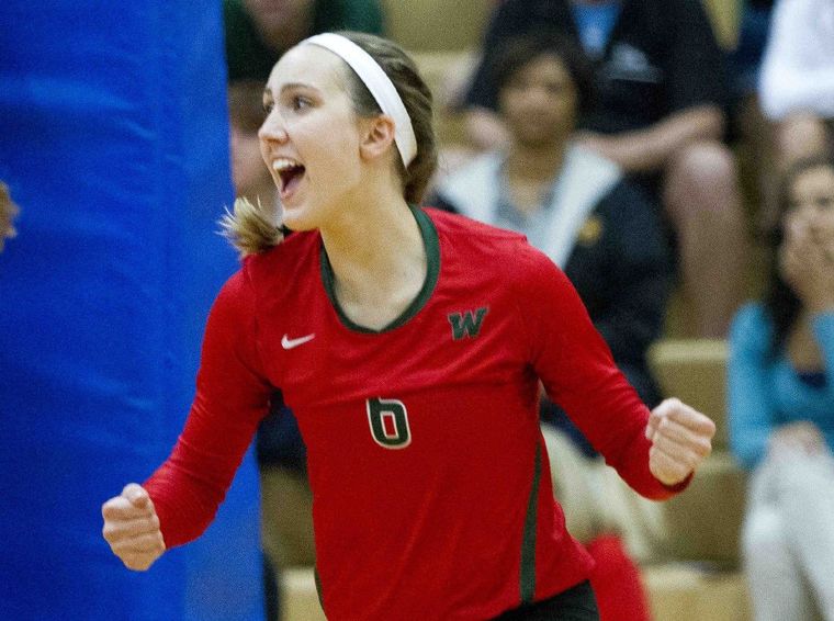 The Woodlands’ Courtney Heiser celebrates a point during a volleyball game Tuesday.