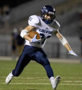 Kingwood's Griffin Lay runs for a first down during a District 16-6A football game Friday.