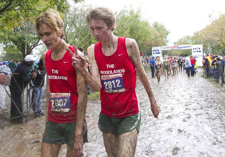 The Woodlands’ Daniel Golden, left, and Noah Wells walk away from the course after finishing first and second in the Class 6A UIL State Cross Country Championships Saturday in Round Rock.