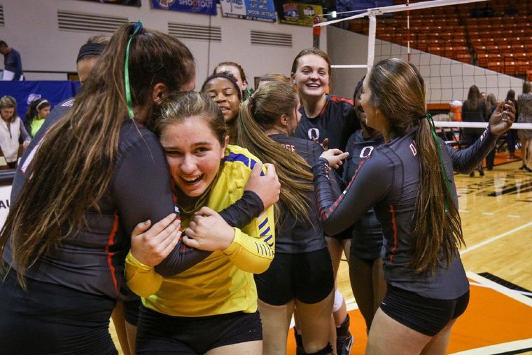 Oak Ridge's Carly Graham (11) embraces teammate Raigen Cianciulli after the Lady War Eagles’ victory over The Woodlands in the Region II-6A tournament on Saturday in Huntsville.