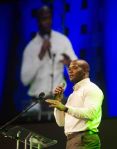 Michael Robinson, former NFL fullback for San Francisco and Seattle, speaks during the Hitman Awards Night Wednesday.