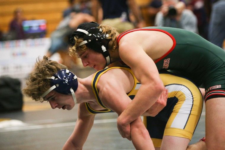 The Woodlands’ Jacob Deitz wrestles Cy-Ranch’s Eric Starr at the TWHS tournament on Friday evening.