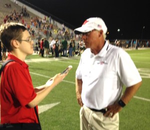Joe Weaver interviews TWHS head football coach Mark Schmid after a game